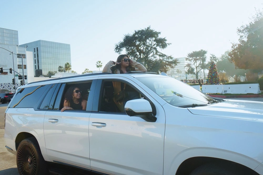 Tour passenger enjoying a Los Angeles sightseeing tour from an open-air vehicle