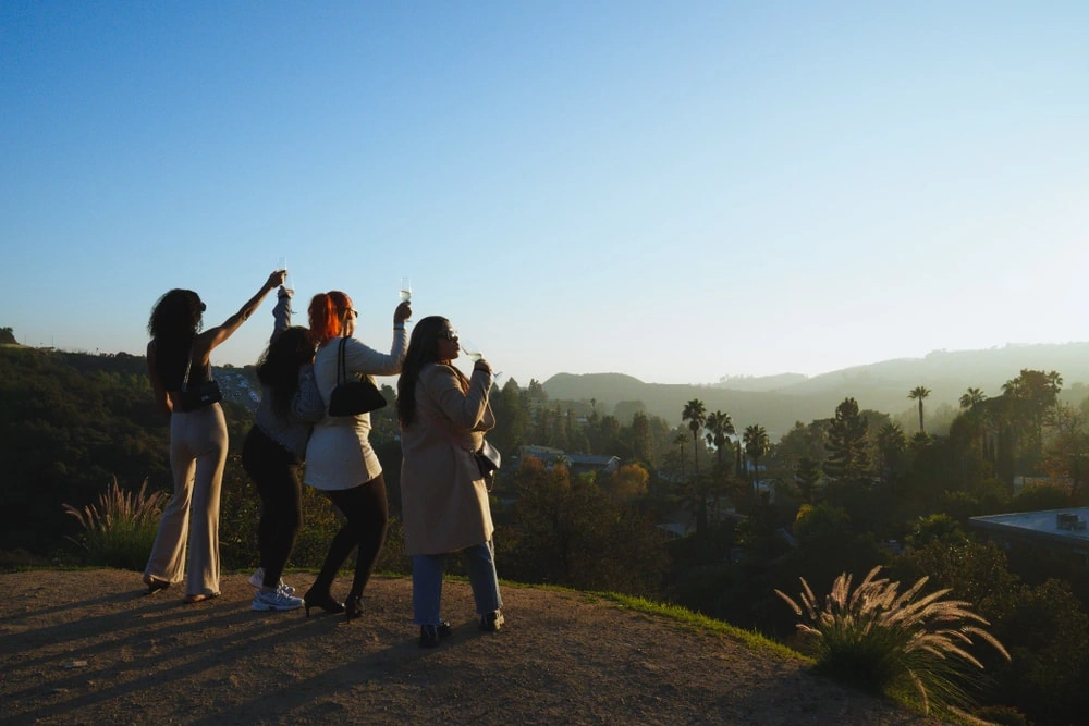Private Hollywood tour guests watching sunset over Los Angeles hills