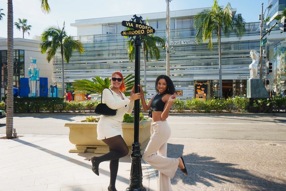 Private Beverly Hills tour guests posing near Rodeo Drive sign